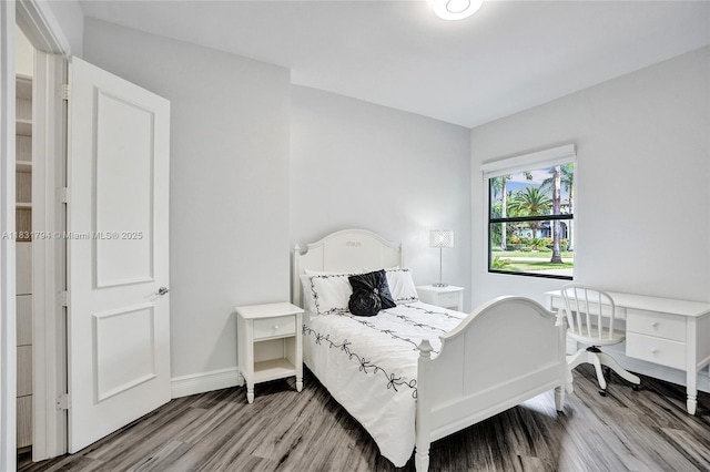 11056 Blackhawk Blvd, Davie, FL 33328 - bedroom with wood finished floors and baseboards