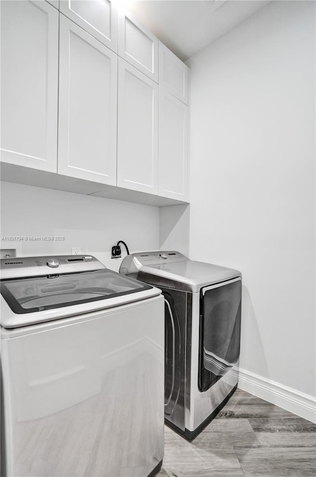 11056 Blackhawk Blvd, Davie, FL 33328 - laundry area featuring cabinet space and washing machine and dryer