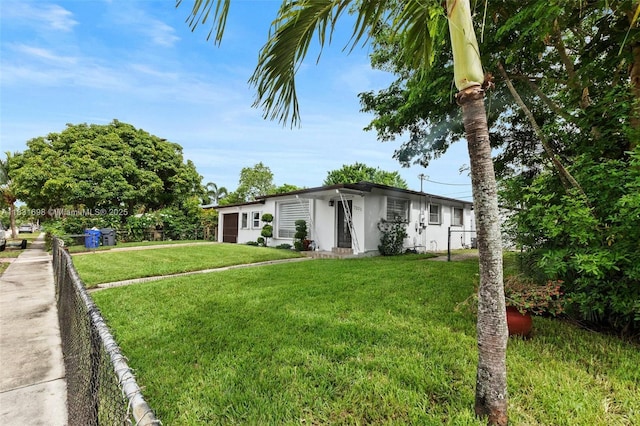 7201 Hayes St, Hollywood, FL 33024 - mid-century modern home featuring an attached garage and stucco siding