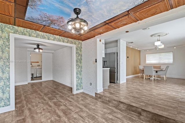 7201 Hayes St, Hollywood, FL 33024 - unfurnished dining area featuring a ceiling fan, wood finished floors, and wallpapered walls