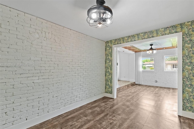 7201 Hayes St, Hollywood, FL 33024 - spare room with brick wall and wallpapered walls