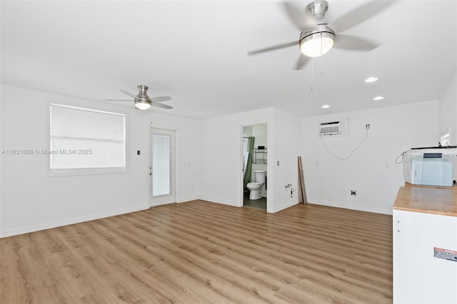 7201 Hayes St, Hollywood, FL 33024 - unfurnished living room featuring a ceiling fan, light wood-type flooring, recessed lighting, and an AC wall unit