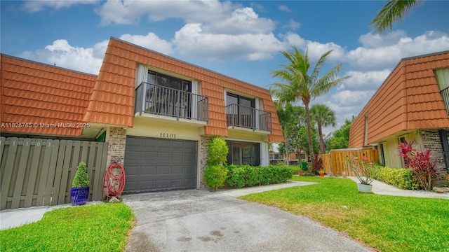 11101 SW 15th Mnr, Davie, FL 33324 - view of front of house featuring concrete driveway, a garage, a tiled roof, a front lawn, and brick siding