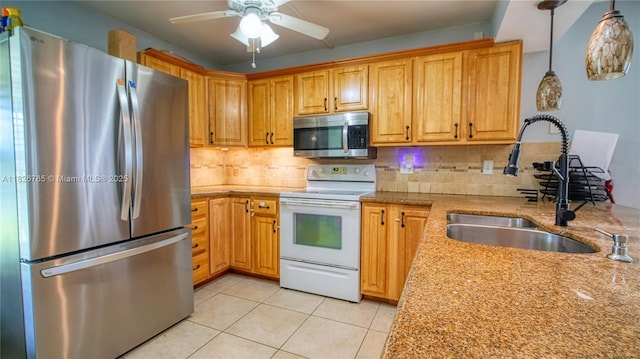 11101 SW 15th Mnr, Davie, FL 33324 - kitchen with stainless steel appliances, ceiling fan, light tile patterned floors, and backsplash