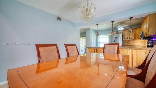 11101 SW 15th Mnr, Davie, FL 33324 - dining area featuring a chandelier and ceiling fan