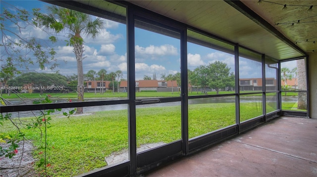 11101 SW 15th Mnr, Davie, FL 33324 - unfurnished sunroom featuring a water view