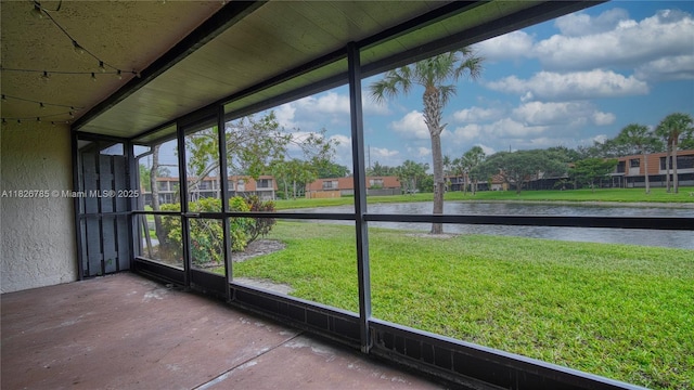 11101 SW 15th Mnr, Davie, FL 33324 - unfurnished sunroom featuring a water view and a residential view