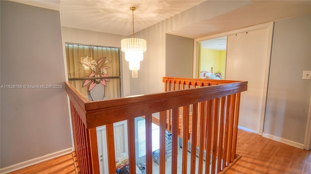 11101 SW 15th Mnr, Davie, FL 33324 - hall with an upstairs landing, wood finished floors, and a chandelier