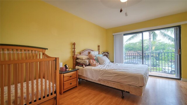 11101 SW 15th Mnr, Davie, FL 33324 - bedroom with light wood-style floors, vaulted ceiling, and access to outside