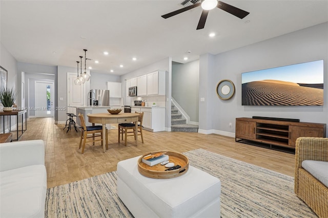 8367 NW 7th Pl Unit 0, Plantation, FL 33324 - living area featuring light wood-style floors, stairs, a ceiling fan, and recessed lighting