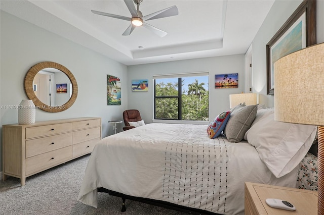 8367 NW 7th Pl Unit 0, Plantation, FL 33324 - carpeted bedroom featuring a tray ceiling and a ceiling fan