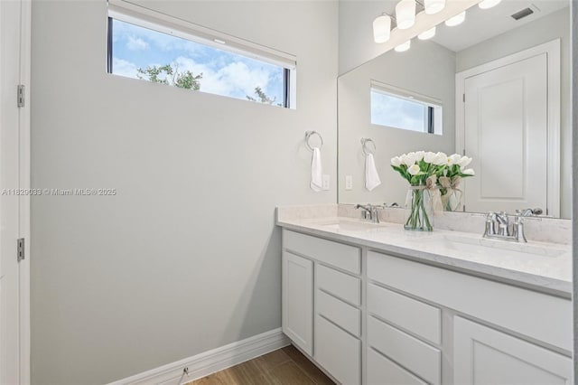 8367 NW 7th Pl Unit 0, Plantation, FL 33324 - full bathroom featuring double vanity, plenty of natural light, and wood finished floors