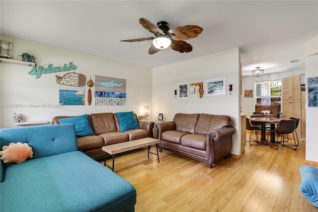 1884 Juno Rd, North Palm Beach, FL 33408 - living area with ceiling fan and light wood-type flooring