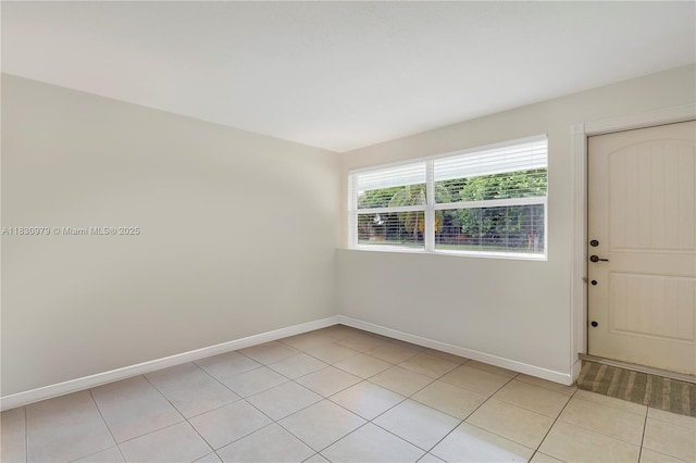 1884 Juno Rd, North Palm Beach, FL 33408 - spare room with light tile patterned flooring