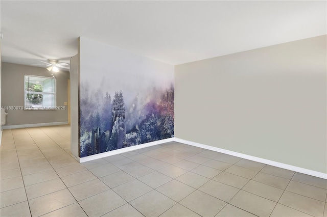 1884 Juno Rd, North Palm Beach, FL 33408 - tiled spare room with baseboards and ceiling fan