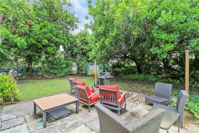 1884 Juno Rd, North Palm Beach, FL 33408 - view of patio / terrace with a grill and an outdoor hangout area