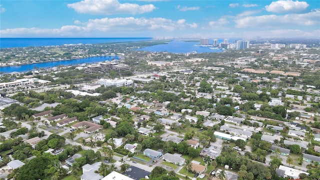 1884 Juno Rd, North Palm Beach, FL 33408 - aerial view of property and surrounding area with a nearby body of water and nearby urban area