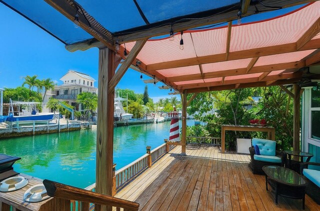 715 E Caribbean Dr E, Lower Keys, FL 33042 - deck featuring a water view and an outdoor living space