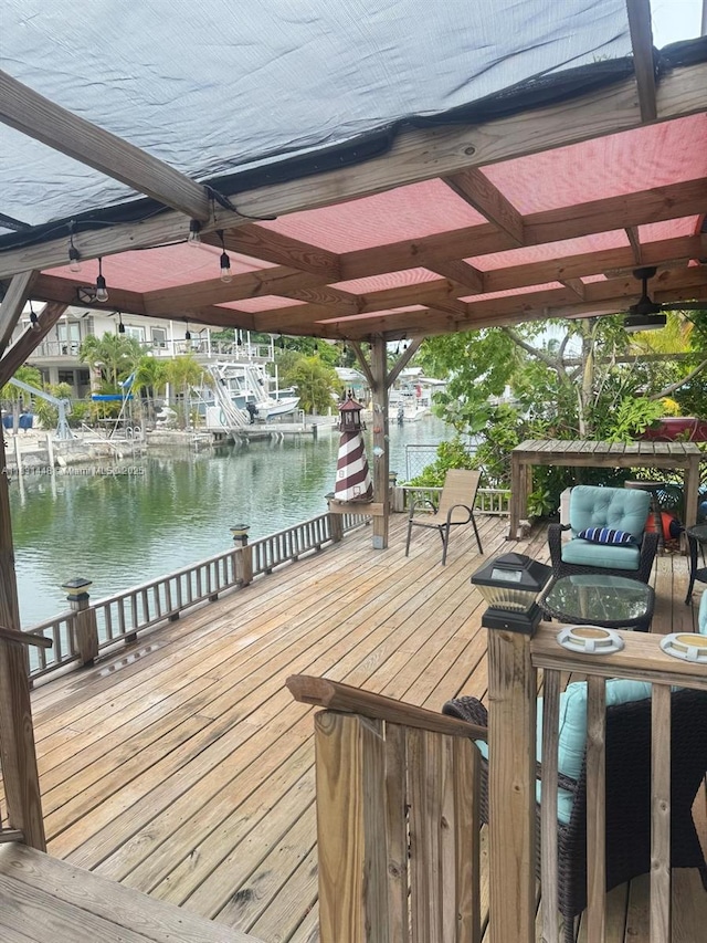 715 E Caribbean Dr E, Lower Keys, FL 33042 - wooden terrace with a water view and a boat dock
