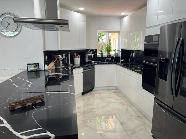 1014 W 68th St, Hialeah, FL 33014 - kitchen featuring appliances with stainless steel finishes, exhaust hood, modern cabinets, decorative backsplash, and white cabinets