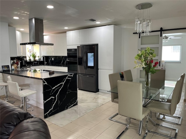 1014 W 68th St, Hialeah, FL 33014 - kitchen featuring black appliances, island exhaust hood, a peninsula, dark countertops, and tasteful backsplash