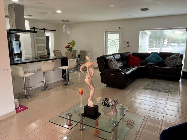 1014 W 68th St, Hialeah, FL 33014 - living room with a barn door and recessed lighting