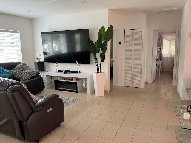 1014 W 68th St, Hialeah, FL 33014 - living room featuring healthy amount of natural light and light tile patterned floors