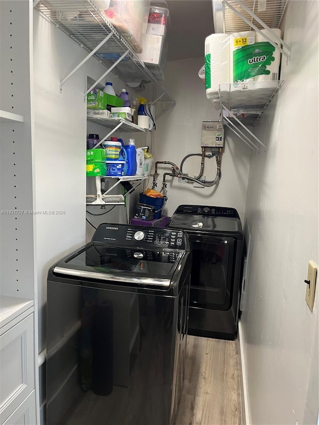 1014 W 68th St, Hialeah, FL 33014 - laundry area with separate washer and dryer and wood finished floors