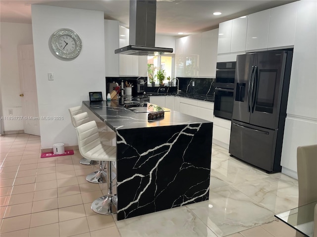 1014 W 68th St, Hialeah, FL 33014 - kitchen featuring black appliances, island range hood, a peninsula, decorative backsplash, and white cabinetry
