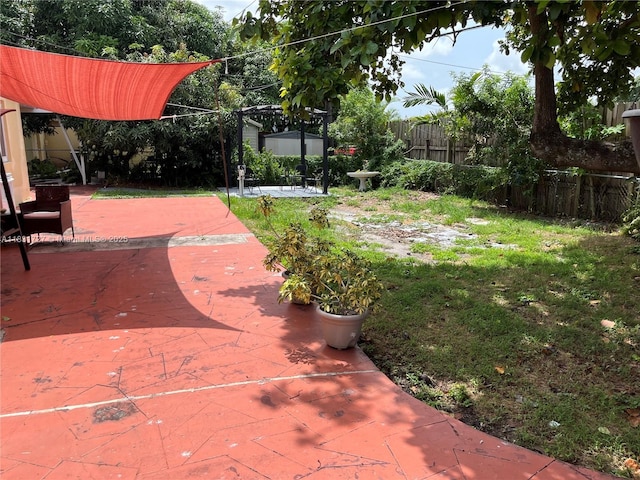 1014 W 68th St, Hialeah, FL 33014 - fenced backyard featuring a patio