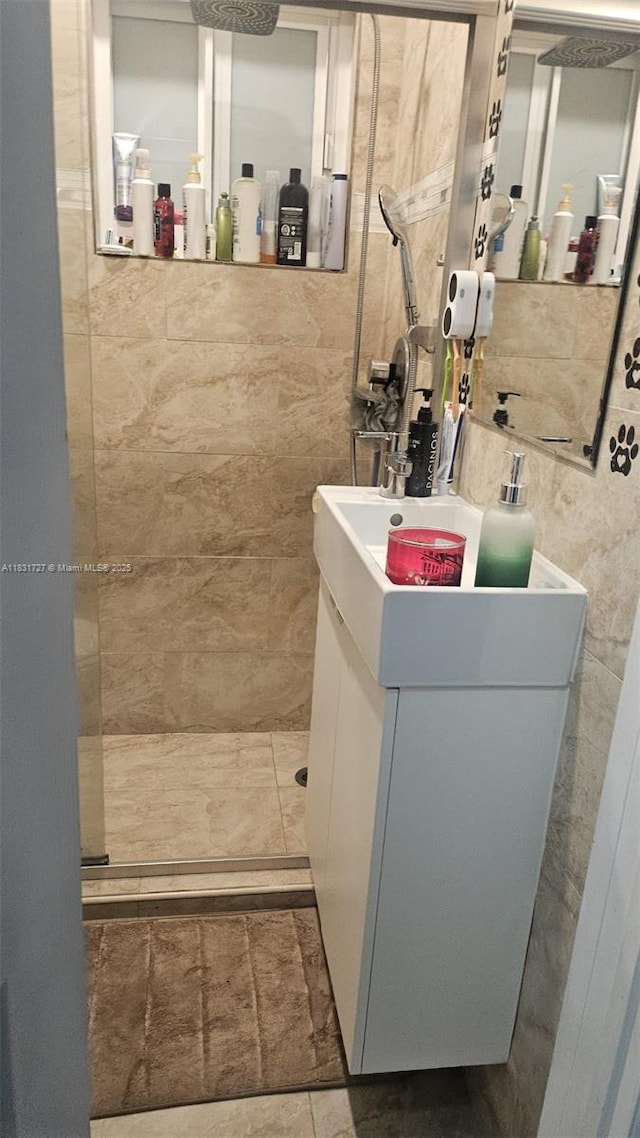 1014 W 68th St, Hialeah, FL 33014 - full bath with tile walls, tiled shower, and vanity