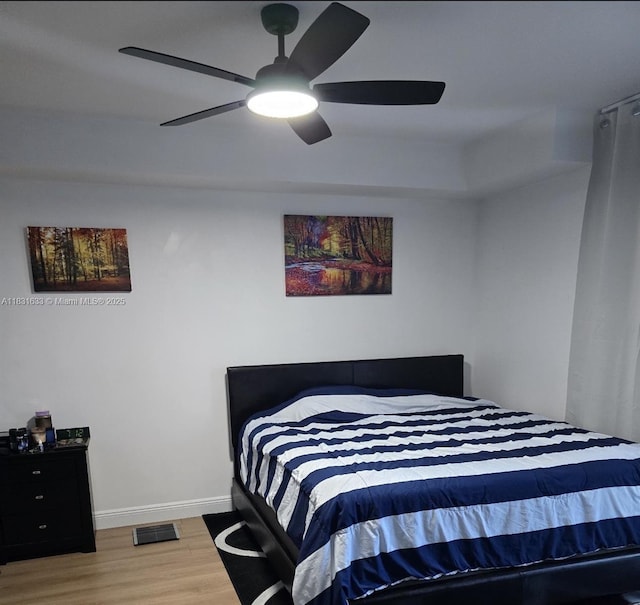 90 SW 3rd St Unit 2214, Miami, FL 33130 - bedroom with wood finished floors and a ceiling fan