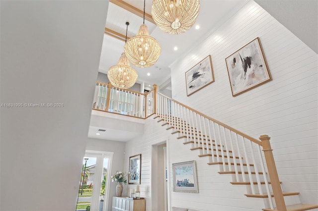 9369 Crestview Cir, Palm Beach Gardens, FL 33412 - stairs with a towering ceiling, a chandelier, and recessed lighting