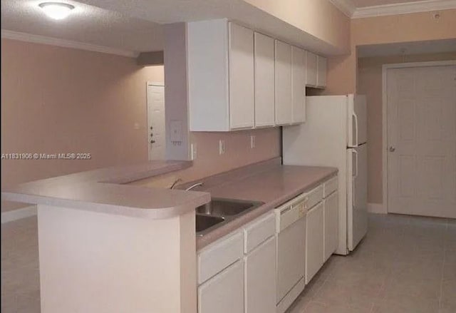 160 SW 117th Ter Unit 6102, Pembroke Pines, FL 33025 - kitchen with white dishwasher, crown molding, white cabinets, light tile patterned floors, and a peninsula