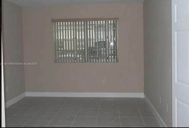 160 SW 117th Ter Unit 6102, Pembroke Pines, FL 33025 - tiled spare room with baseboards