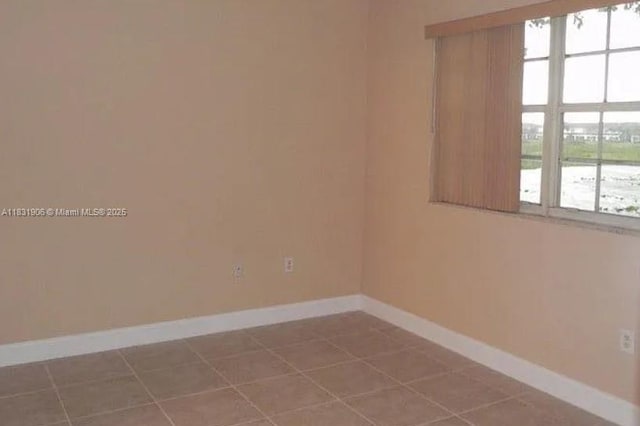 160 SW 117th Ter Unit 6102, Pembroke Pines, FL 33025 - tiled empty room with baseboards