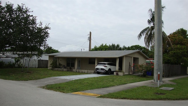 1500 NE 33rd Ct, Pompano Beach, FL 33064 - ranch-style house featuring driveway and an attached carport