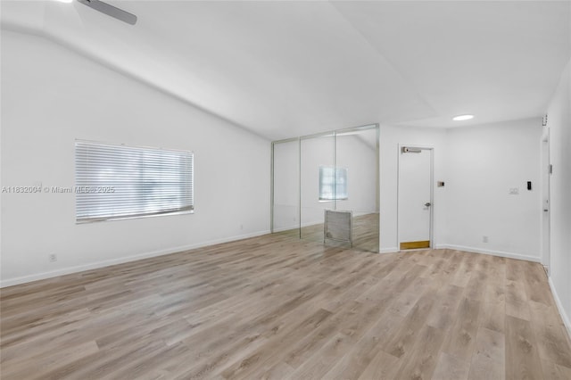 8031 NW 47th Ct, Lauderhill, FL 33351 - empty room featuring healthy amount of natural light, light wood-type flooring, lofted ceiling, and ceiling fan