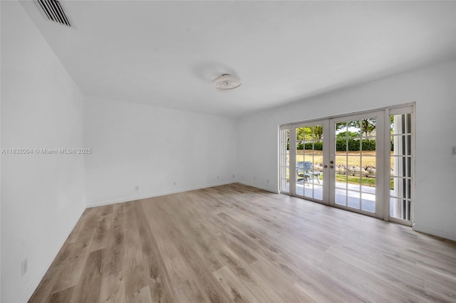 8031 NW 47th Ct, Lauderhill, FL 33351 - spare room featuring french doors and light wood-style floors