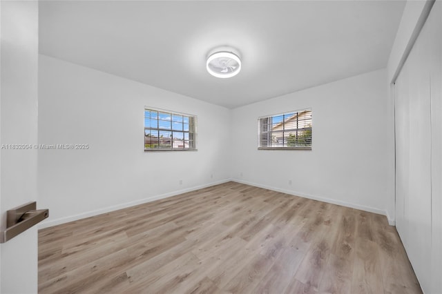 8031 NW 47th Ct, Lauderhill, FL 33351 - spare room featuring light wood-style flooring and baseboards