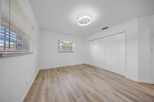 8031 NW 47th Ct, Lauderhill, FL 33351 - unfurnished bedroom featuring wood finished floors and a closet