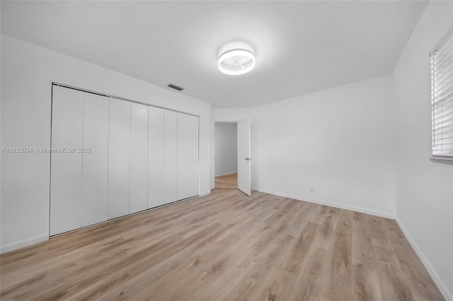 8031 NW 47th Ct, Lauderhill, FL 33351 - unfurnished bedroom with light wood-style flooring and a closet