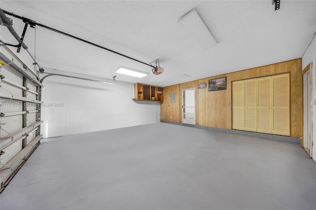 8031 NW 47th Ct, Lauderhill, FL 33351 - garage featuring wood walls and a garage door opener