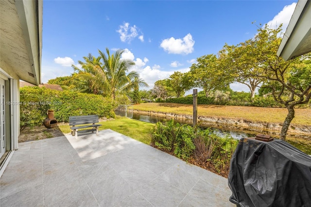 8031 NW 47th Ct, Lauderhill, FL 33351 - view of patio with area for grilling and a water view