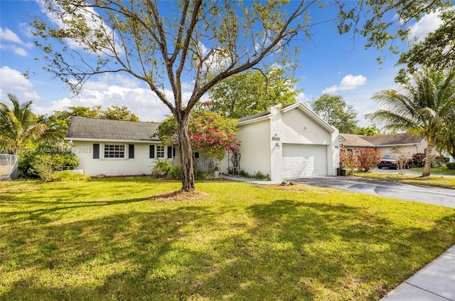 8031 NW 47th Ct, Lauderhill, FL 33351 - view of front of property featuring stucco siding, a garage, driveway, and a front lawn
