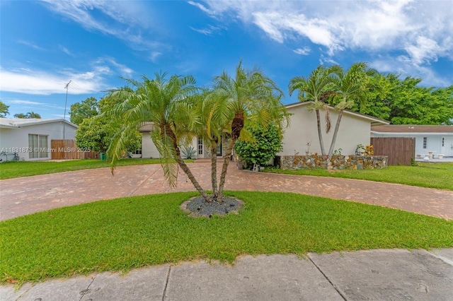 10600 SW 199th St, Cutler Bay, FL 33157 - view of front of property with curved driveway, a front lawn, and stucco siding