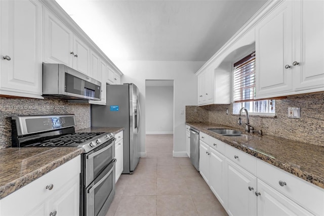 10600 SW 199th St, Cutler Bay, FL 33157 - kitchen with stainless steel appliances, white cabinetry, and backsplash