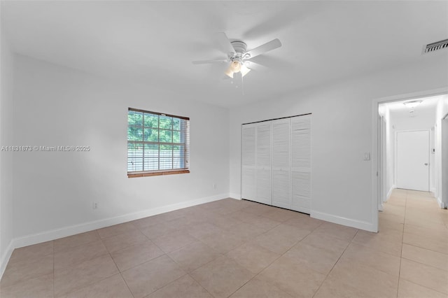 10600 SW 199th St, Cutler Bay, FL 33157 - unfurnished bedroom featuring a closet, light tile patterned floors, and a ceiling fan