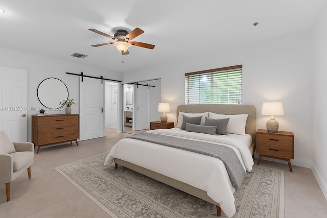 10600 SW 199th St, Cutler Bay, FL 33157 - bedroom featuring a barn door, light tile patterned floors, and ceiling fan