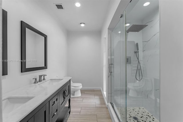 10600 SW 199th St, Cutler Bay, FL 33157 - bathroom featuring double vanity, a shower stall, and recessed lighting